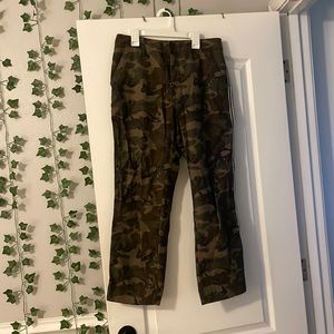 Camo pants with black and white stripe on the side
